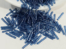 Load image into Gallery viewer, Montana Blue Transp. - Twisted Myuki Bugle Beads - 12x2mm - 10grams
